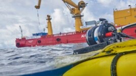 The manned submersible emerges from the water after a dive off the coast of the island of St. Joseph in the Seychelles, Monday April 8, 2019. For more than a month researchers from Nekton, a British-led scientific research group.