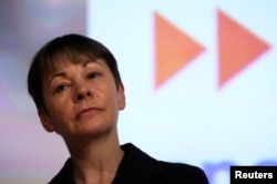 FILE - Green Party MP Caroline Lucas speaks at a "Vote In - Another Europe is Possible " rally in London, May 28, 2016.