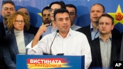 FILE - Zoran Zaev, the leader of the opposition Social-Democratic Alliance of Macedonia, gestures while speaking at a news conference at the party headquarters in Skopje, Macedonia, March 2, 2015.