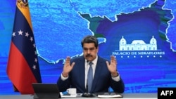 FILE - Venezuelan President Nicolas Maduro speaks during a press conference at the Miraflores Presidential Palace in Caracas, on August 16, 2021.