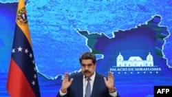 FILE - Venezuelan President Nicolas Maduro speaks during a press conference at the Miraflores Presidential Palace in Caracas, on August 16, 2021.