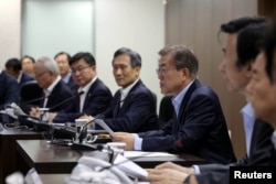 South Korean President Moon Jae-in presides over National Security Council at the Presidential Blue House in Seoul, South Korea, May 14, 2017.