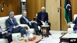 The ambassadors of Spain, Jose Antonio Bordallo (L), of Britain, Peter Millet (2nd L), and of France, Antoine Sivan (3rd L), are welcomed by the Libyan Deputy Prime Minister of the Government of National Accord, Ahmad Meitig (R), in Tripoli on April 14, 2016.