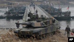 U.S. M1A2 SEP Abrams battle tanks cross the Hantan river during a river crossing operation, part of an annual joint military exercise between South Korea and the United States.