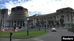 A police car is seen in front of the parliament building in Wellington, New Zealand, Sept. 21, 2017. 