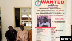 Wanted sign for Boko Haram leader Abubakar Shekau pasted on a wall in Baga village on the outskirts of Maiduguri, northeastern state of Borno, Nigeria, May 13, 2013.