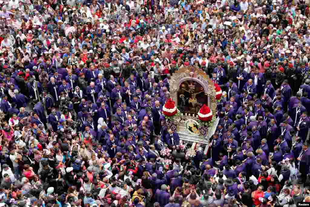 Faithful attend the procession of Senor de Los Milagros (Lord of Miracles), Peru&#39;s most revered Catholic religious icon, in Lima, Peru, Oct. 18, 2018.