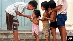 Cambodian orphans play together as they wait for adoption at Kien Klaing orphanage center in Phnom Penh, (File)