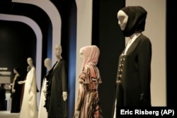 In this photo taken Thursday, Sept. 20, 2018, a number of headscarves and ensembles are seen in the exhibit Contemporary Muslim Fashions at the M. H. de Young Memorial Museum in San Francisco.