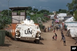 FILE---In this file photo taken Monday, July 25, 2016, A UN armoured personnel vehicle stand in a refugee camp in Juba, South Sudan.