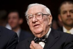 FILE - In this April 30, 2014, file photo, retired Supreme Court Justice John Paul Stevens appears before the Senate Rules Committee on Capitol Hill in Washington.