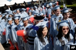 Students participate in a graduation ceremony at Columbia University in New York, May 17, 2017.