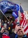 FILE - Insurrectionists loyal to U.S. President Donald Trump riot outside the Capitol, Jan. 6, 2021, in Washington. The Southern Poverty Law Center counted 702 anti-government groups in 2022, a 44% increase from 488 in 2021, according to a new report.