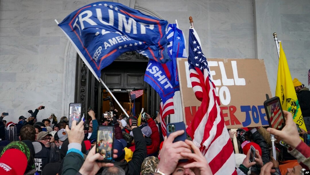 FILE - Insurrections loyal to President Donald Trump riot outside the Capitol, Jan. 6, 2021, in Washington.