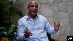 Former Haitian Prime Minister Laurent Lamothe speaks during an interview with Associated Press in Port-au-Prince, Dec. 15, 2014. 