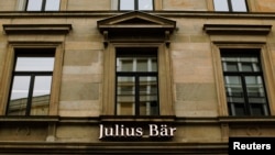 Swiss private bank Julius Baer, reported a slump in profits, is being investigated by U.S. authorities cracking down on tax evasion, Feb. 4, 2013.