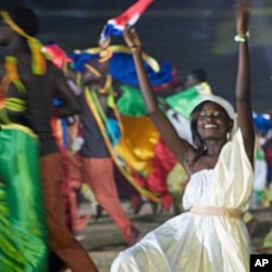 A woman dances as part of the opening ceremony celebration at the World Festival of Black Arts in Dakar