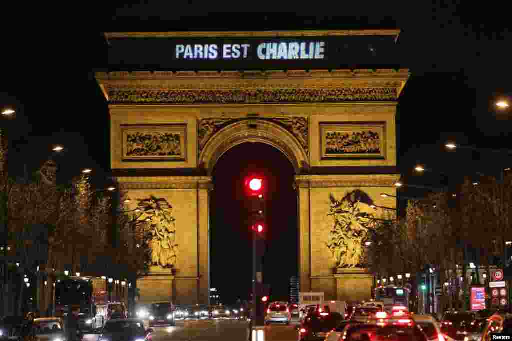 The message "Paris is Charlie" is projected on the Arc de Triomphe in Paris, Jan. 9, 2015, in tribute to the victims following Wednesday's deadly attack at the Paris offices of Charlie Hebdo. 