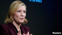 FILE - Actress Cate Blanchett, goodwill ambassador for the United Nations High Commissioner for Refugees (UNHCR), gestures as she attends the World Economic Forum (WEF) annual meeting in Davos, Switzerland, Jan. 23, 2018. 
