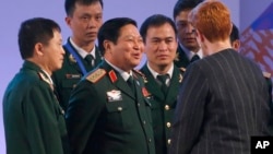 FILE - Vietnamese Defense Minister Gen. Ngo Xuan Lich, center, talks to then-Australian Defense Minister Marise Payne at the two-day ASEAN Defense Ministers Meeting, Oct. 24, 2017, north of Manila, Philippines.