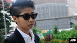 This photograph taken on April 2, 2013 shows Singaporean artist Samantha Lo Xin Hu, 26, arriving at the Subordinate courts in Singapore.