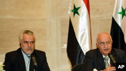 Syrian PM Mohammed Naji Otri (R) and Iran's First VP Mohammad Reza Rahimi (L) speak during a joint press conference after signing agreements in Damascus on 30 Apr 2010