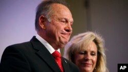 Former Alabama Chief Justice and U.S. Senate candidate Roy Moore speaks at a news conference with his wife Kayla Moore, in Birmingham, Alabama, Nov. 16, 2017.