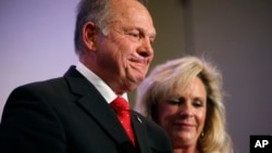 Former Alabama Chief Justice and U.S. Senate candidate Roy Moore speaks at a news conference with his wife Kayla Moore, in Birmingham, Ala., Nov. 16, 2017.