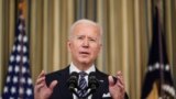 U.S. President Joe Biden delivers remarks on the implementation of the American Rescue Plan in the State Dining Room at the White House in Washington, March 15, 2021.