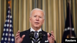 U.S. President Joe Biden delivers remarks on the implementation of the American Rescue Plan in the State Dining Room at the White House in Washington, March 15, 2021.