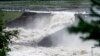 Water flows after the dam burst at the Braskereidfoss power plant in southern Norway, with water flowing into the Glomma River after floodgates did not open properly on Aug. 9, 2023.