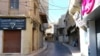 FILE - This picture shows closed shops on an empty street in the eastern Lebanese city of Baalbeck on Oct. 19, 2024. 