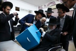 Ultra-orthodox man votes during elections in Bnei Brak, Israel, March 2, 2020.