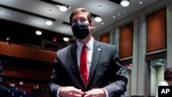 FILE - Defense Secretary Mark Esper leaves after a House Armed Services Committee hearing, July 9, 2020, on Capitol Hill in Washington.