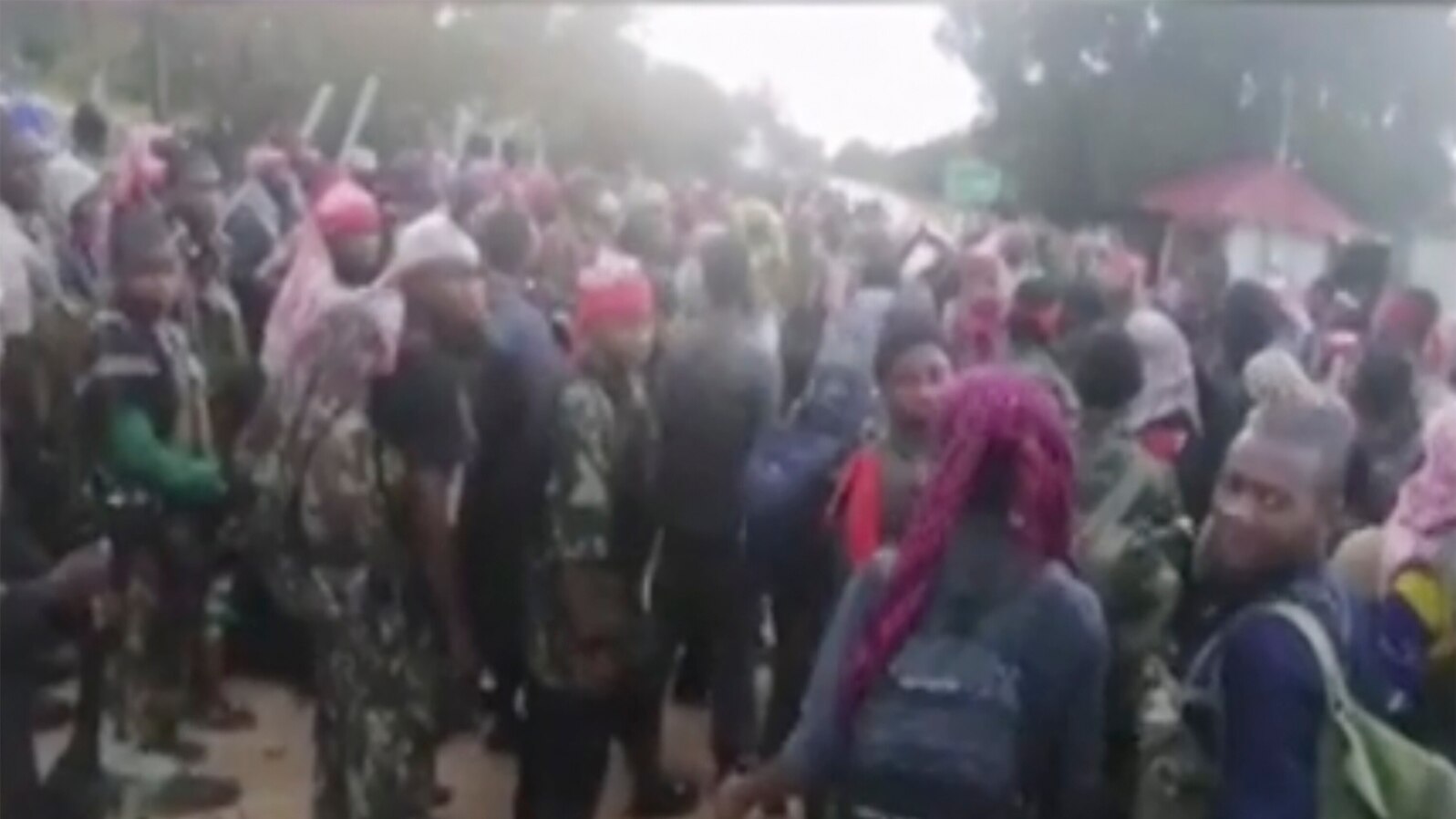 In this image taken from militant video released by the Islamic State group on Monday March 29, 2021, purporting to show fighters near the strategic north eastern Mozambique town of Palma.