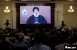 Lebanon's Hezbollah leader Sayyed Hassan Nasrallah speaks during a televised address at a memorial service for Taleb Abdallah, a senior field commander who was killed on June 11 in an Israeli strike in Beirut's southern suburbs, June 19, 2024.