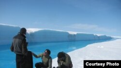 Meltwater drains from Greenland’s ice sheet at such a fast rate that researchers couldn’t risk entering the water to get readings so they used a remote-controlled drone boat. (UCLA/ Laurence C. Smith)