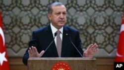 FILE - Turkish President Recep Tayyip Erdogan speaks to local administrators at his palace in Ankara, Turkey, Nov. 26, 2015. He voiced regret Nov. 28 about Turkey's downing of a Russian warplane.