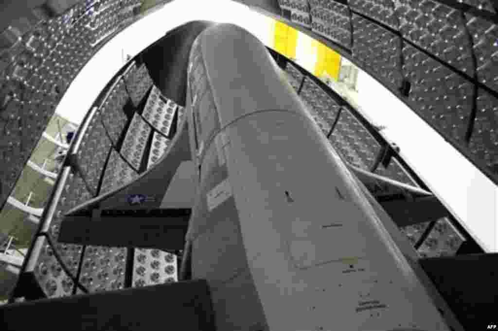 This April 2010 photo released by the U.S. Air Force shows the X-37B Orbital Test Vehicle in the encapsulation cell at the Astrotech facility in Titusville, Fla. The U.S. Air Force's secrecy-shrouded X-37B unmanned spaceplane returned to Earth early Frida