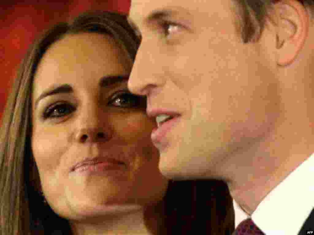 Britain's Prince William and his fiancee Kate Middleton pose for the media at St. James's Palace in London after announcing their marriage, London, Tuesday, Nov. 16, 2010. The couple are to wed in 2011.(AP Photo/Sang Tan)