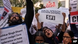 FILE - Activists of various left organizations shout slogans during a protest against hate speech in New Delhi, India, Dec.27 2021.