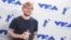 Ed Sheeran poses in the press room with the award for artist of the year at the MTV Video Music Awards at The Forum on Aug. 27, 2017, in Inglewood, Calif. 