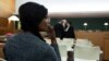 A Nigerian defendant waits in the courtroom prior to the start of a trial of a prostitution network case in Lyon, France, Nov. 6, 2019. 
