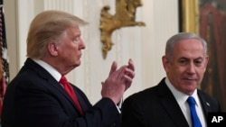 FILE - President Donald Trump listens as Israeli Prime Minister Benjamin Netanyahu speaks during an event at the White House in Washington, Jan. 28, 2020, to announce the Trump administration's plan to resolve the Israeli-Palestinian conflict. 