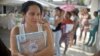 A pregnant woman holds a mosquito net in Cali, Colombia, Feb. 10, 2016. The Colombian Health Ministry began delivering mosquito nets for free to pregnant women to prevent the infection by Zika virus, vectored by the Aedes aegypti mosquito.