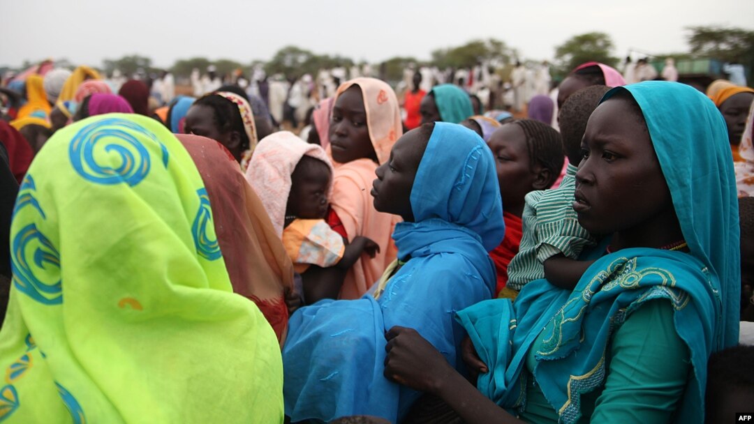 This photo taken on June 15, 2012, at the Jamam refugee camp, shows mothers queueing at a Medecin Sans Frontiere (MSF) field hospital in South Sudan's Upper Nile state, where over 100,000 refugees have fled conflict in Sudan's Blue Nile state since Sept.