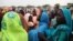 This photo taken on June 15, 2012, at the Jamam refugee camp, shows mothers queueing at a Medecin Sans Frontiere (MSF) field hospital in South Sudan's Upper Nile state, where over 100,000 refugees have fled conflict in Sudan's Blue Nile state since Sept.
