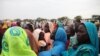 This photo taken on June 15, 2012, at the Jamam refugee camp, shows mothers queueing at a Medecin Sans Frontiere (MSF) field hospital in South Sudan's Upper Nile state, where over 100,000 refugees have fled conflict in Sudan's Blue Nile state since Septem