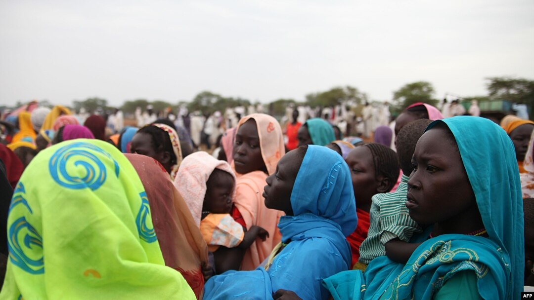 This photo taken on June 15, 2012, at the Jamam refugee camp, shows mothers queueing at a Medecin Sans Frontiere (MSF) field hospital in South Sudan's Upper Nile state.