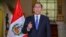In this photo provided by the Peruvian government, President Martin Vizcarra delivers a national address from the government palace in Lima, Sept. 16, 2018.